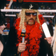 Just two weeks after his attempt at unionizing was busted, Jesse Ventura prepares for a live shot with Elvira at WrestleMania 2.